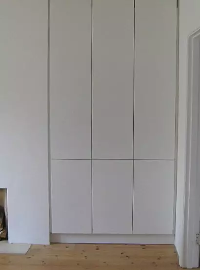 Built-in cupboards with push release doors